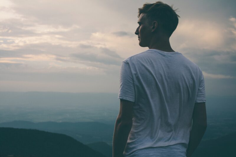 A man's back looking into the distance