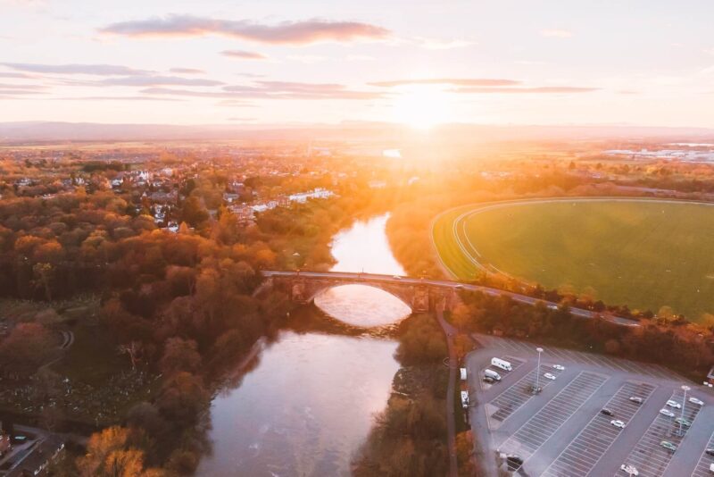 http://A%20birds-eye%20view%20of%20a%20river%20and%20a%20bridge%20in%20Chester,%20situated%20in%20Cheshire